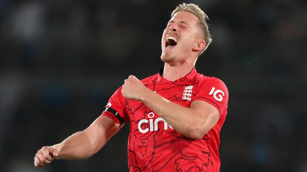 England bowler Luke Wood celebrates taking a wicket