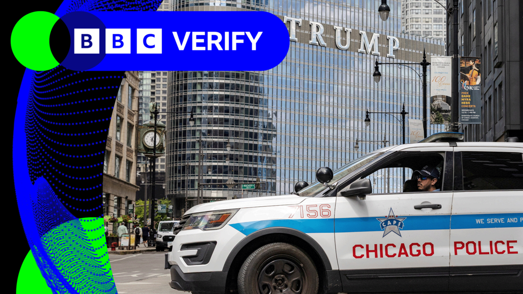 A Chicago Police car in front of a building with the Trump sign