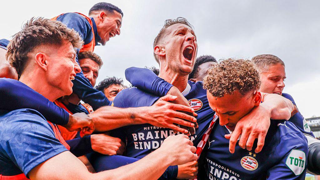Luuk de Jong of PSV Eindhoven celebrates with teammates after scoring his teams second goal against Sparta Rotterdam.