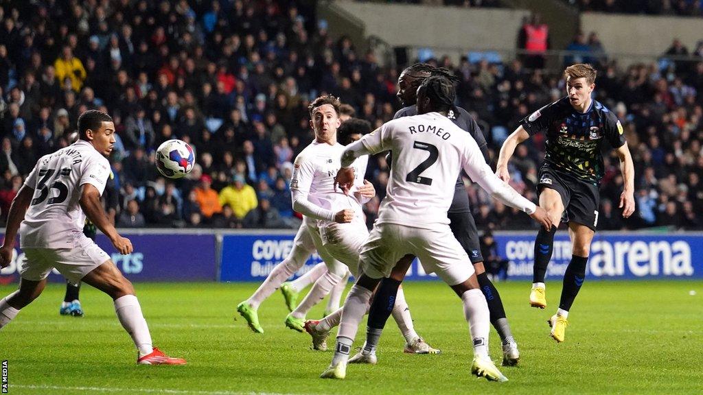 Coventry City's Ben Sheaf watches his snap-shot come off the Cardiff City post