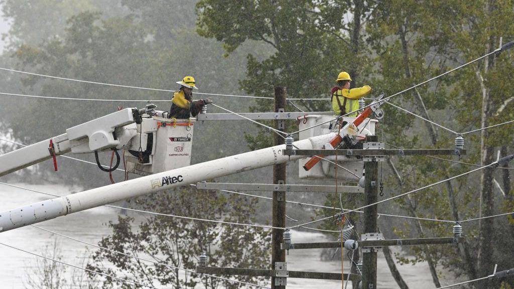 Rescue workers restoring electricity