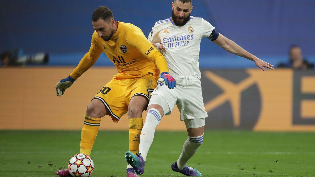 Donnarumma is caught on the ball by Real Madrid's Karim Benzema during the second leg of PSG's Champions League last-16 tie against Real Madrid in 2022