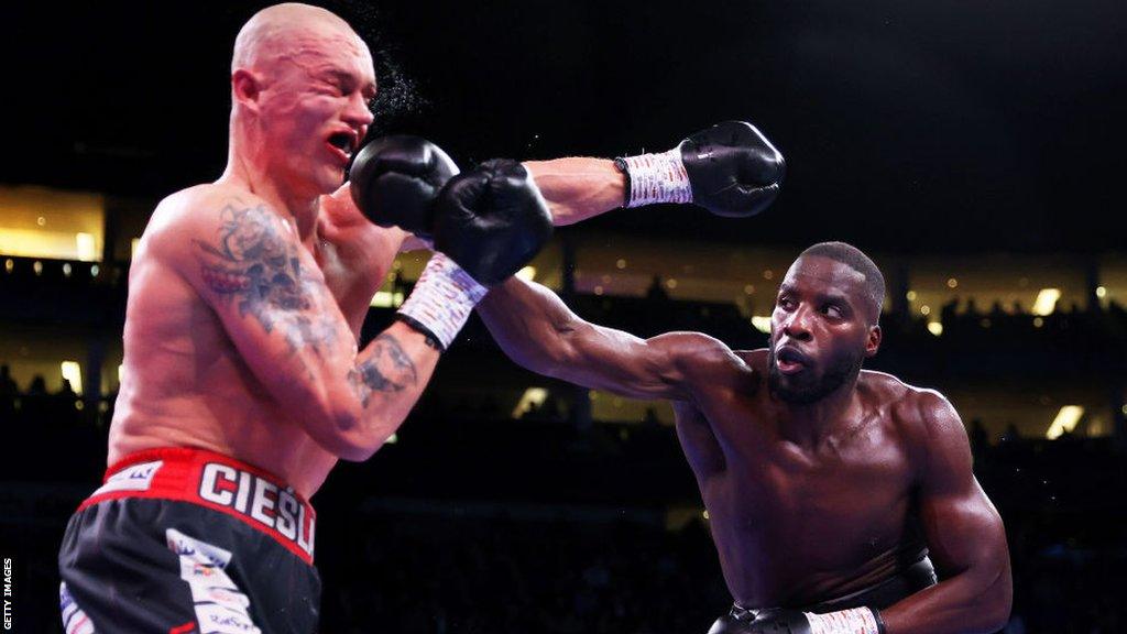 Lawrence Okolie punches his opponent