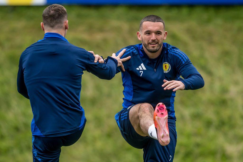 Scotland's-John-McGinn-with-teammate. 