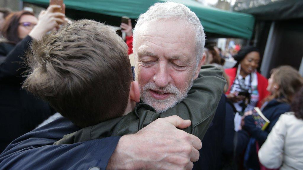 Corbyn hugs supporter