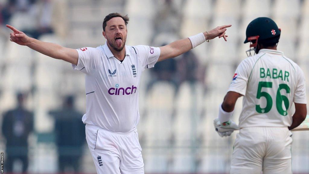 England bowler Ollie Robinson reacts after bowling Pakistan captain Babar Azam