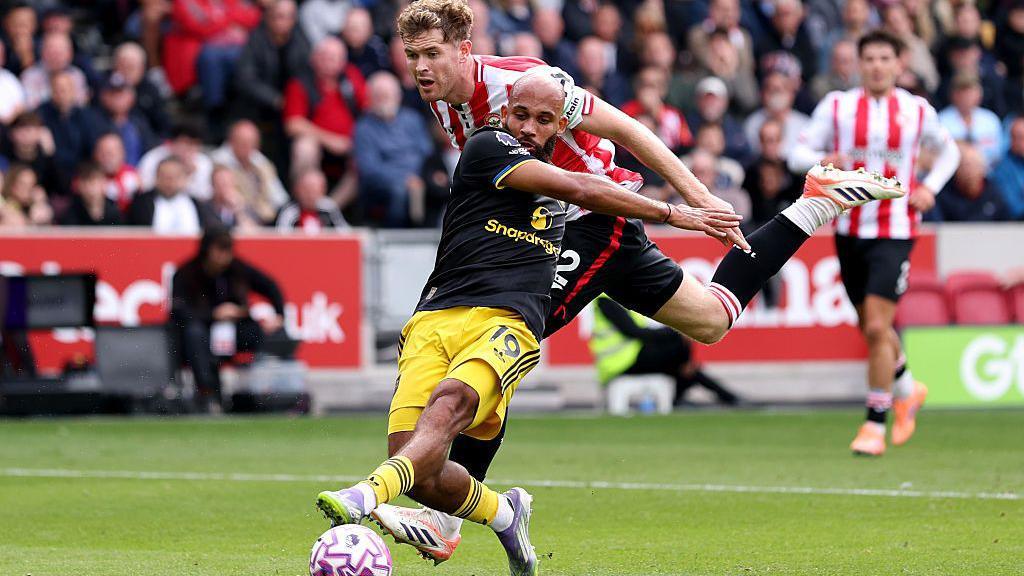 Nathan Collins of Brentford fouls Bryan Mbeumo of Manchester United leading to a penalty being awarded