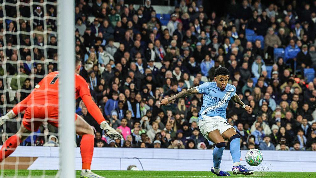 Savinho of Manchester City scores
