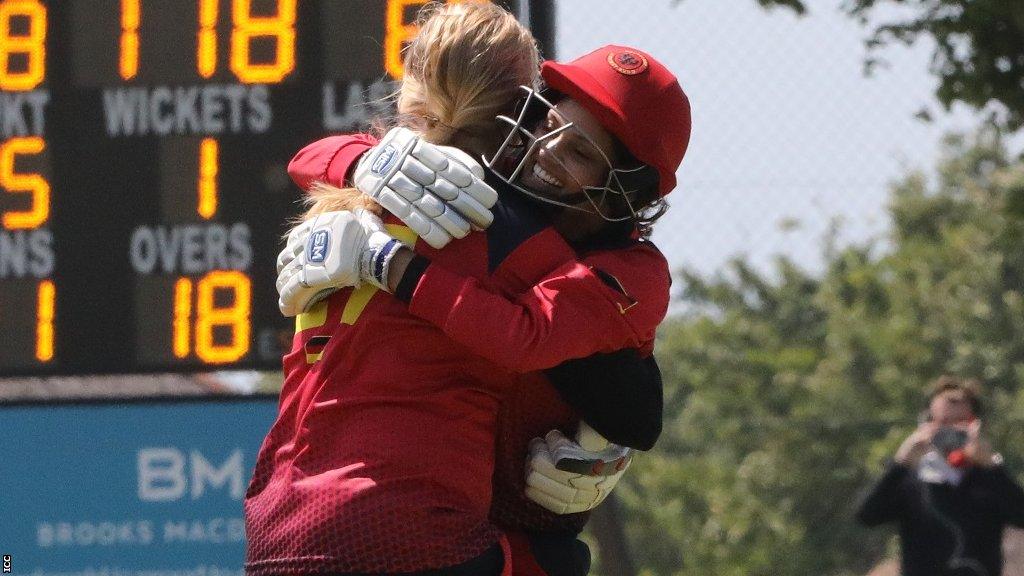 Germany's Christina Gough and Anuradha Doddaballapur celebrate hitting the winning run