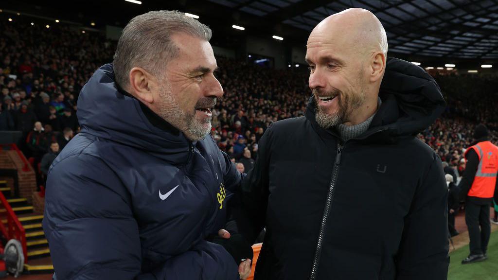 Erik ten Hag greets manager Ange Postecoglou before the match