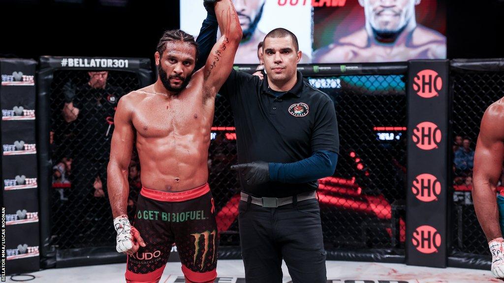 AJ McKee celebrates beating Sidney Outlaw at Bellator 301 in November