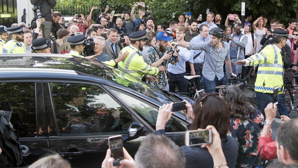 Crowds gather around Boris Johnson's car as he leaves his home in Islingto