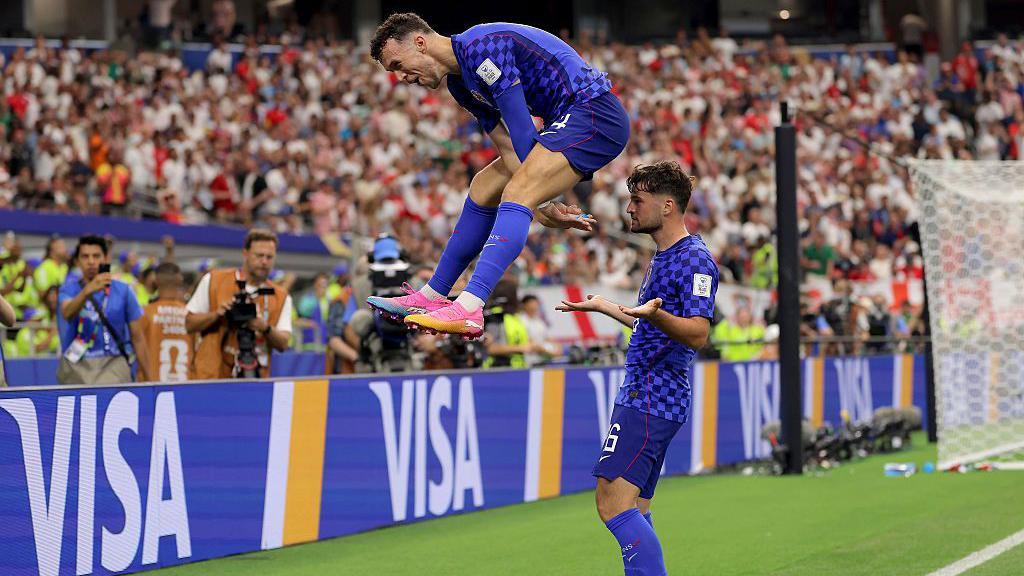 Croatia celebrating scoring a goal.