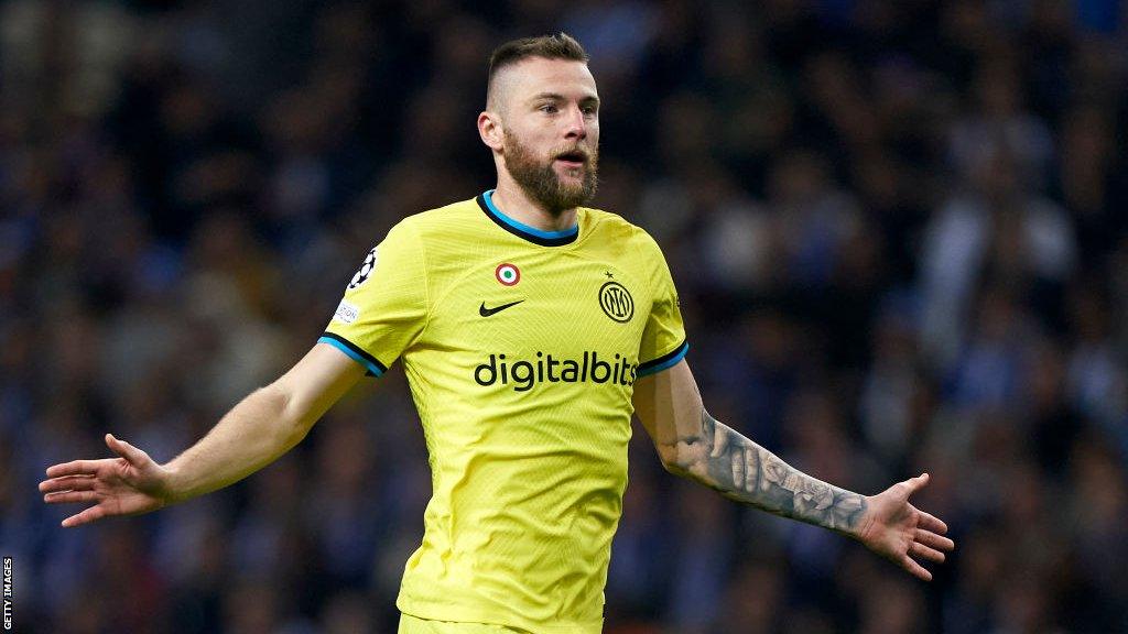 Milan Skriniar gestures with both hands during an Inter Milan game