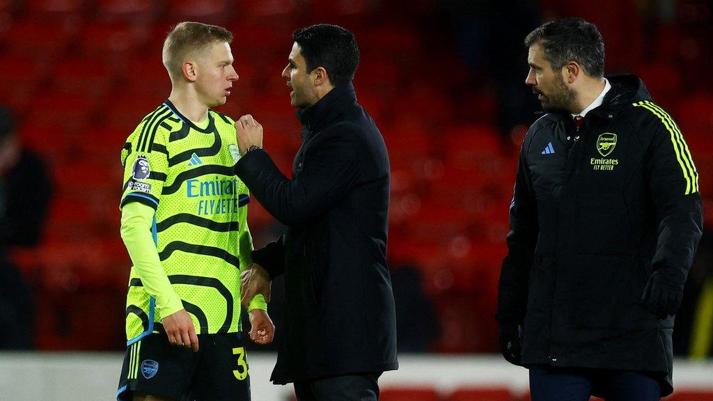 Oleksandr Zinchenko speaking to manager Mikel Arteta