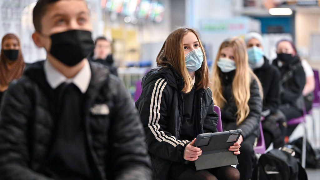 Pupils in a Scottish high school wearing face masks and sitting socially distanced from each other during the Covid pandemic