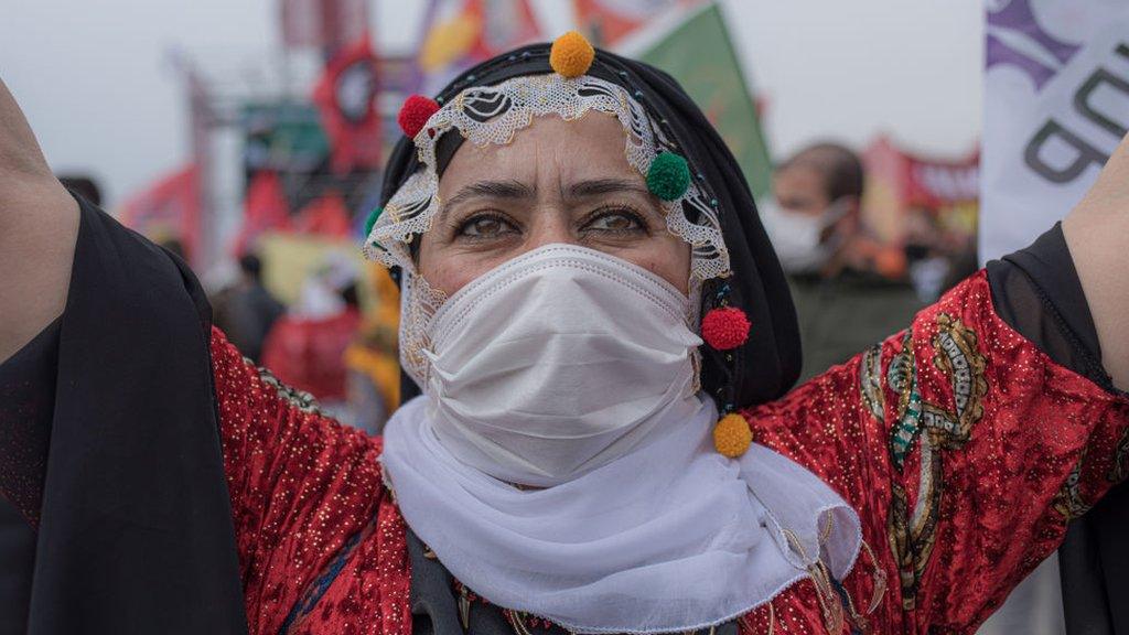 Kurdish woman poses for a photo during the Newroz festival in Istanbul