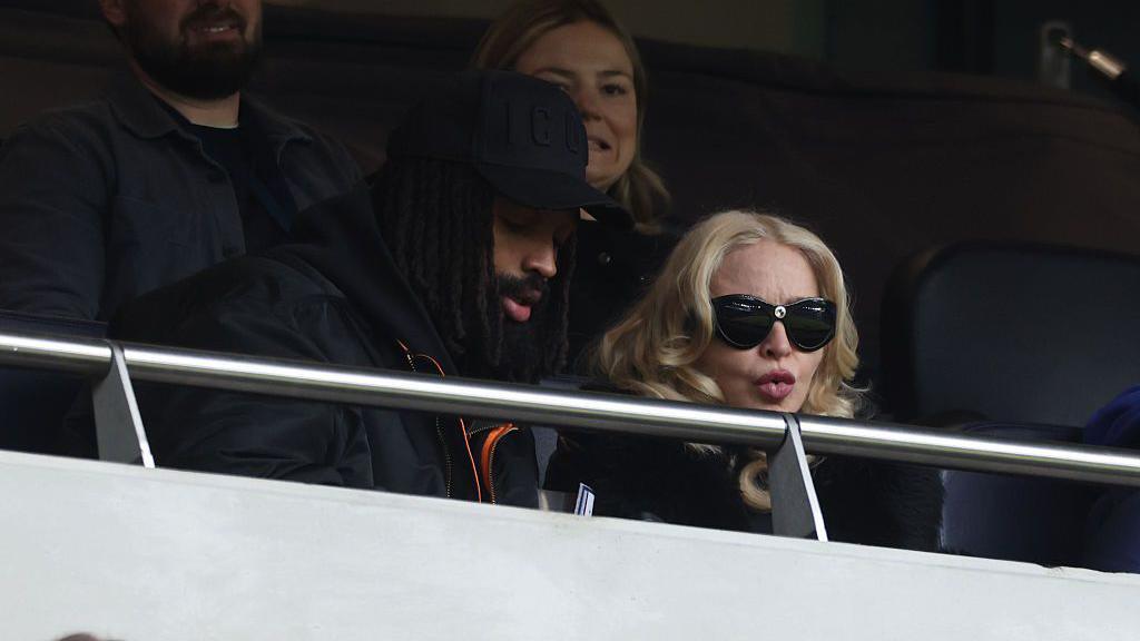 Madonna and Akeem Morris at the Women's Super League match between Tottenham and Chelsea at Tottenham Hotspur Stadium