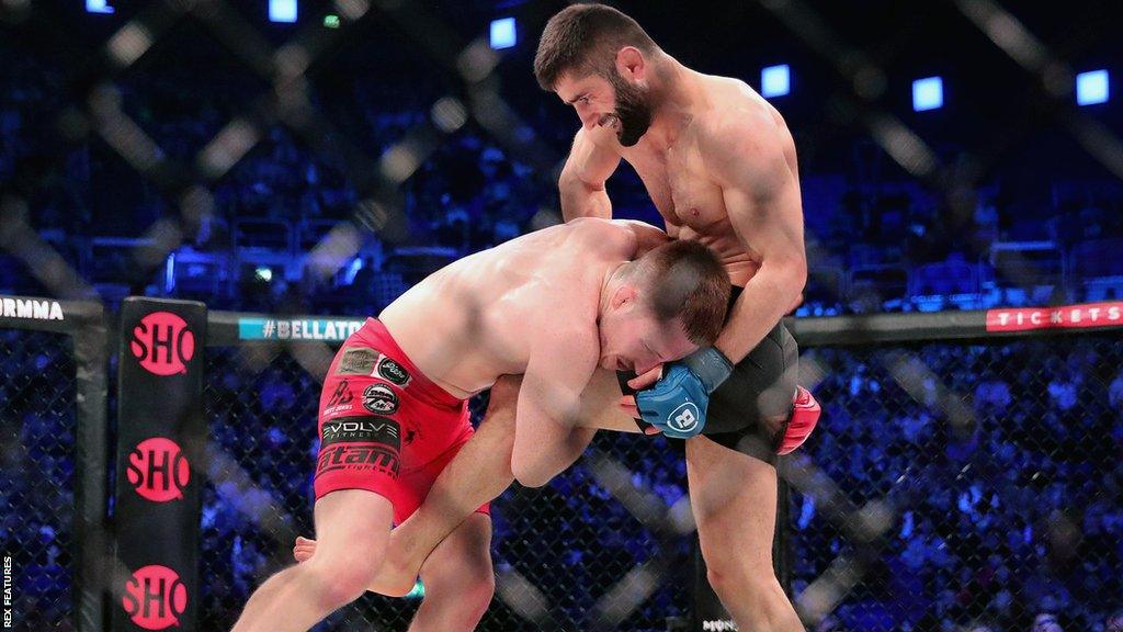 Brett Johns' recent fights include victory over Khurshed Kakhorov (R)