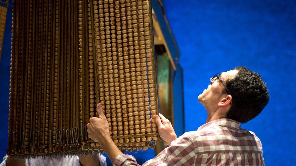 Workers prepare the items during the eve of the Spanish Christmas Lottery draw at the "Teatro Real", the Royal Opera house in Madrid.