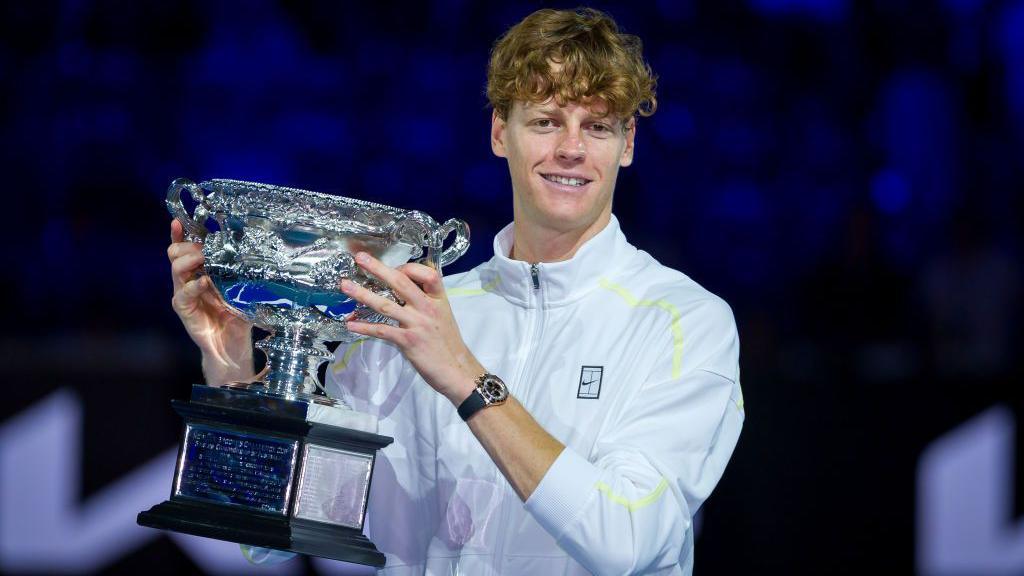 Jannik Sinner holds the Australian Open trophy