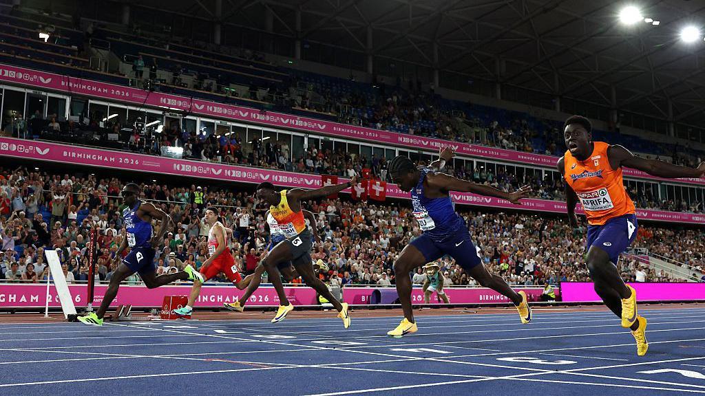 Runners crossing the finish line.