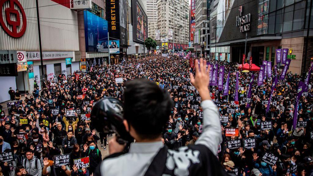 People take part in a pro-democracy march in Hong Kong on January 1, 2020