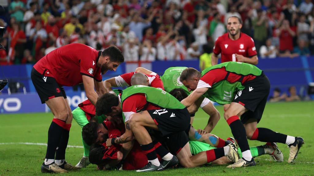 Georgia celebrate after beating Portugal