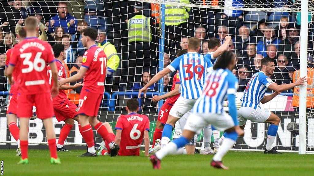 Huddersfield Town's Matty Pearson (right) celebrates scoring their side's first goal of the game against Blackburn