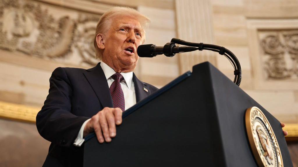 Donald Trump at a podium in the Capitol building