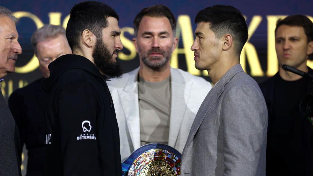 Artur Beterbiev and Dmitry Bivol stand face-to-face