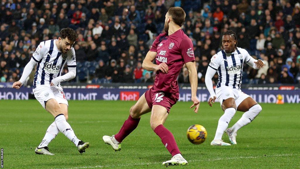 Mikey Johnston (left) scores for West Brom against Cardiff