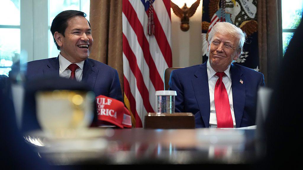 President Donald Trump listens as U.S. Secretary of State Marco Rubio speaks during a Cabinet meeting at the White House