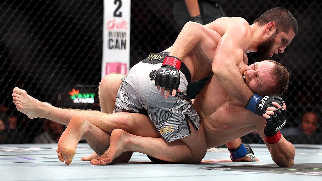 Islam Makhachev grapples with Jack Della Maddalena