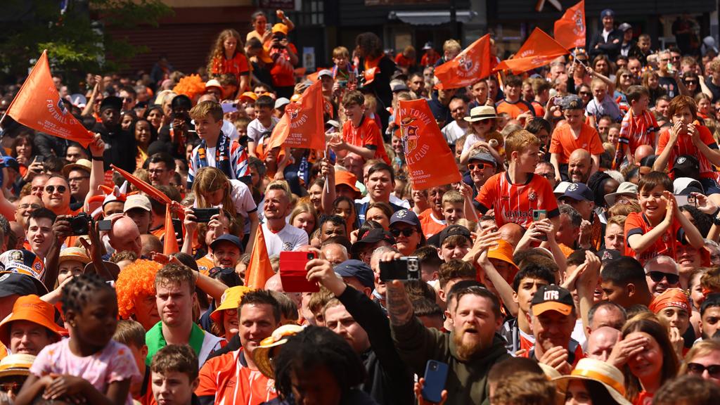 Luton Town fans celebrating in St George's Square in the town