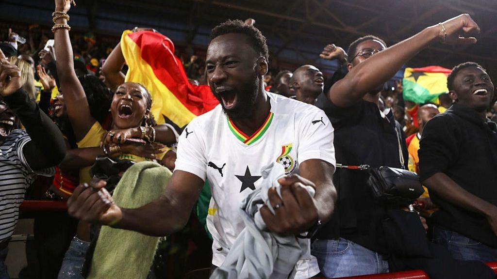 Ghana fans celebrate their first goal during the Unity Cup match against Nigeria