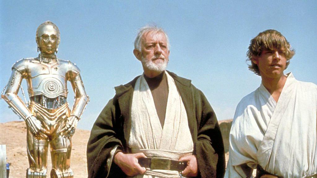 British actors Anthony Daniels, Alec Guinness and American Mark Hamill on the set of Star Wars: Episode IV - A New Hope.