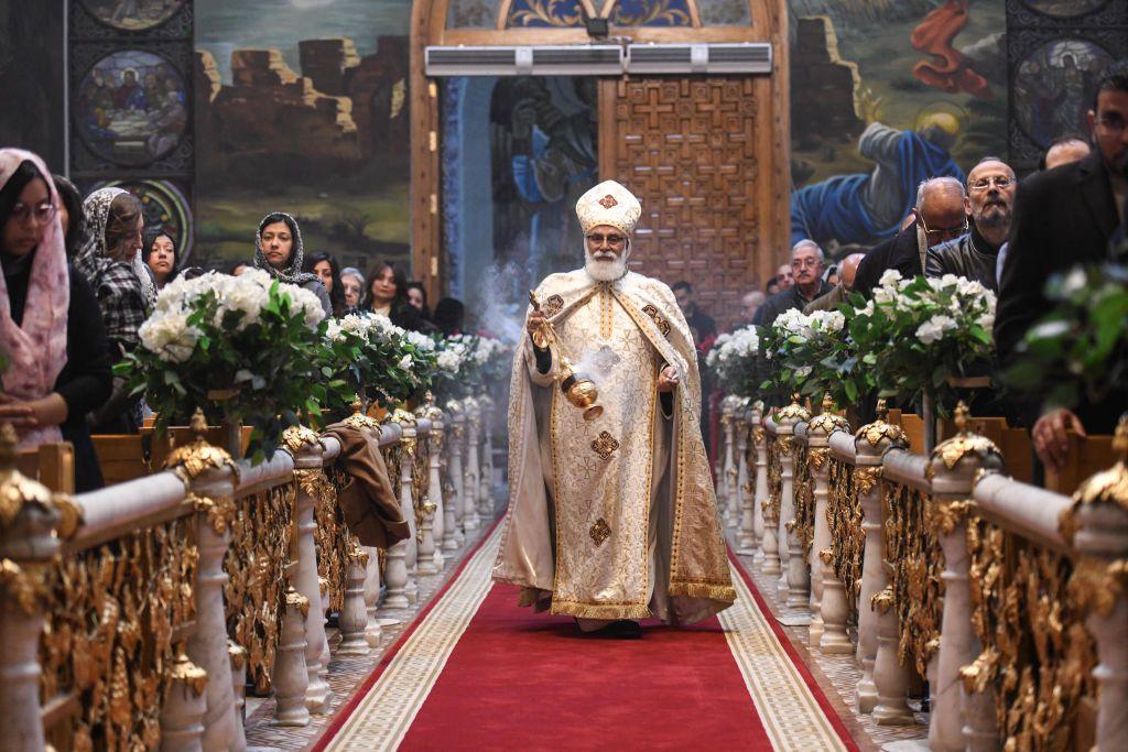 A priest leads Orthodox Christmas Eve celebrations at the Archangel Michael Coptic Orthodox Church in Cairo on January 6, 2025. 