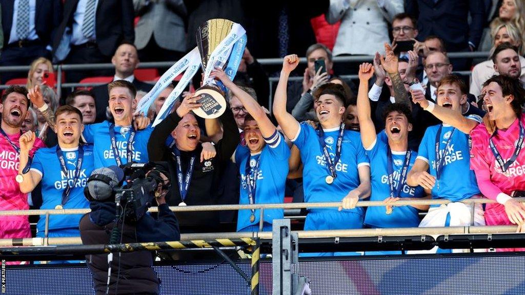 Harrison Burrows and Darren Ferguson lift the EFL Trophy