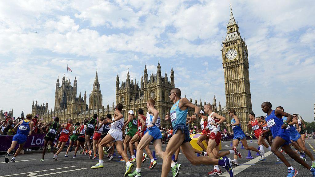 Runners going past the Houses of Parliament.