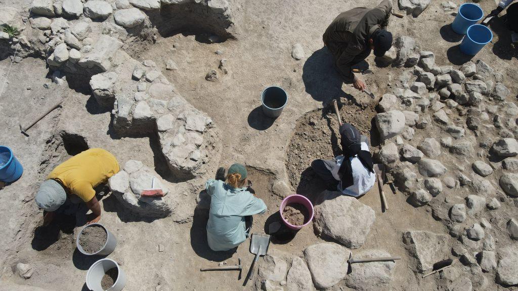  An aerial view of archeologists working on the excavation operation area, aiming to find remains from the Iron Age, conducted by Turkish Ministry of Culture and Tourism and Usak University in the Hittite city of Nerik in Vezirkopru district of Samsun, Turkiye on August 27, 2023.