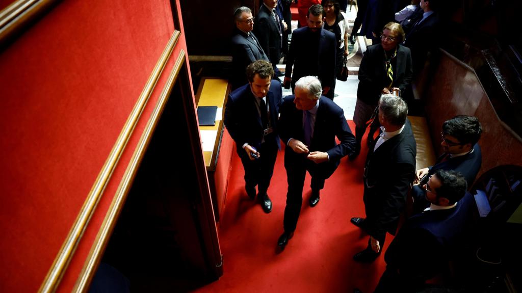 French Prime Minister Michel Barnier leaves after the result of the vote on the first motion of no-confidence against the French government, tabled by the alliance of left-wing parties the "Nouveau Front Populaire" (New Popular Front - NFP), after the use by French government of the article 49.3, a special clause in the French Constitution, to push the budget bill through the National Assembly without a vote by lawmakers, at the National Assembly in Paris, France, December 4, 2024. REUTERS/Sarah Meyssonnie