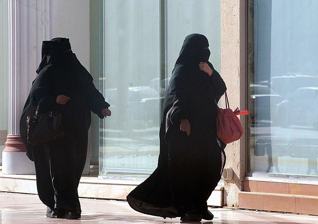 Photo shows two Muslim women in full veil out shopping.