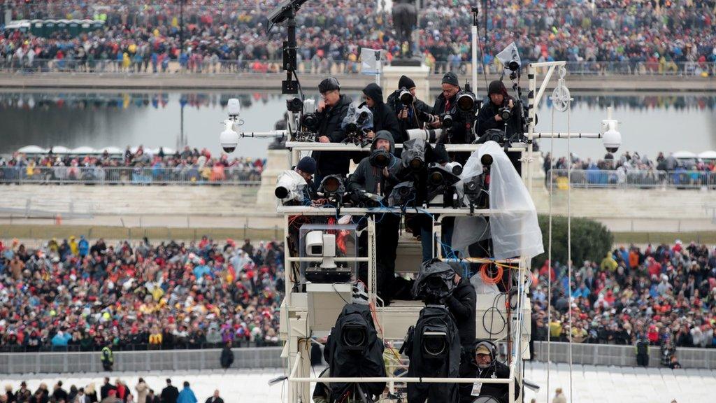 The media prepares for Trump's inauguration ceremony in the rain