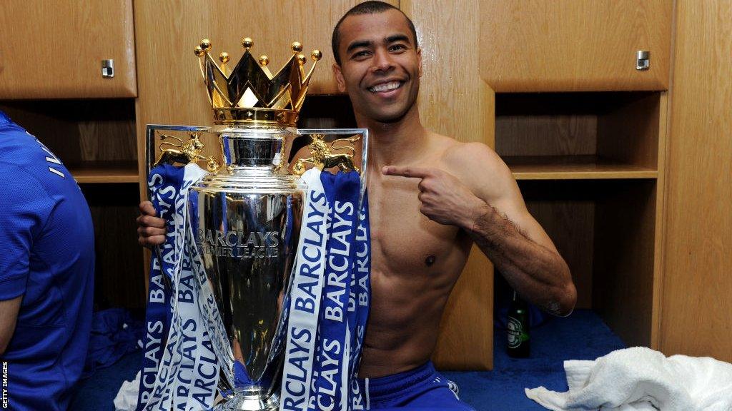 Ashley Cole celebrates winning the Premier League with Chelsea