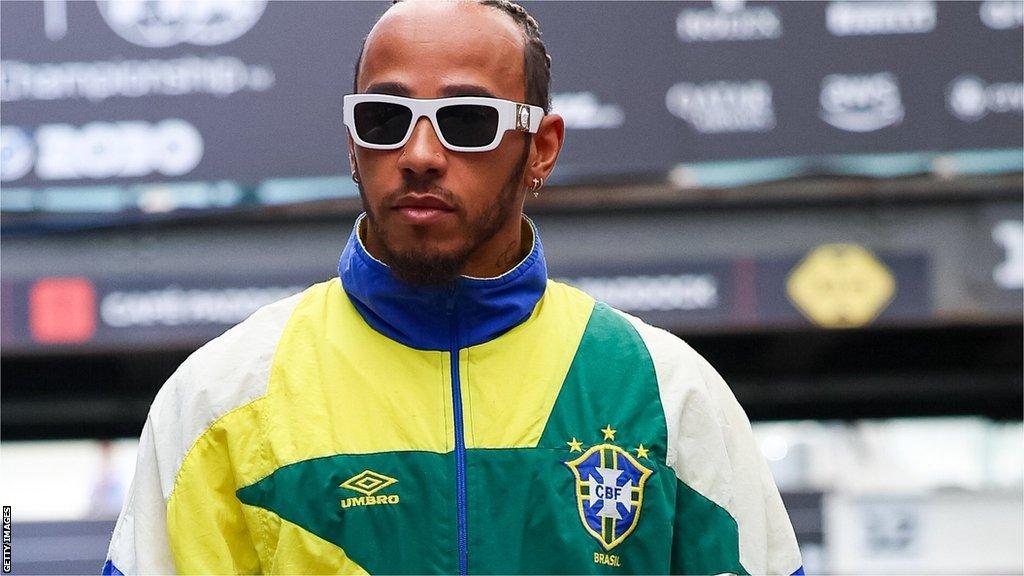 Lewis Hamilton arrives at Interlagos wearing a 1990s Brazil football tracksuit top