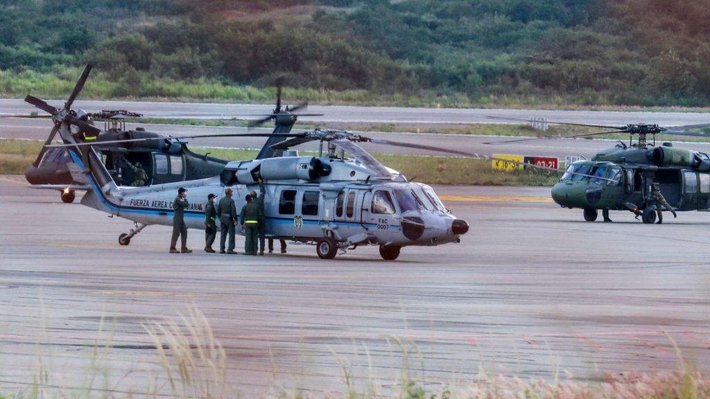 The Colombian president's helicopter sits on the runway after it is hit by gunfire, June 2021