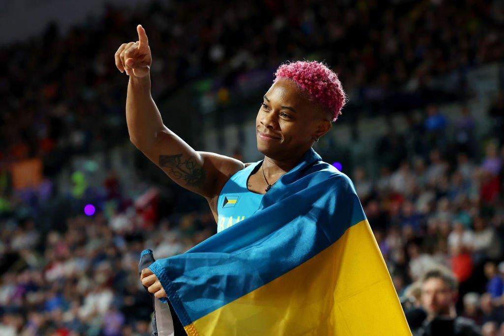 Devynne Charlton of Team Bahamas gestures after winning and setting a new world record