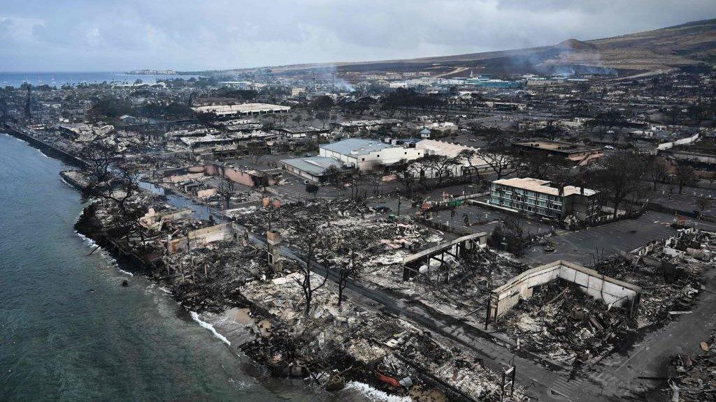 An aerial image taken on August 10, 2023 shows destroyed homes and buildings on the waterfront burned to the ground in Lahaina in the aftermath of wildfires in western Maui, Hawaii.