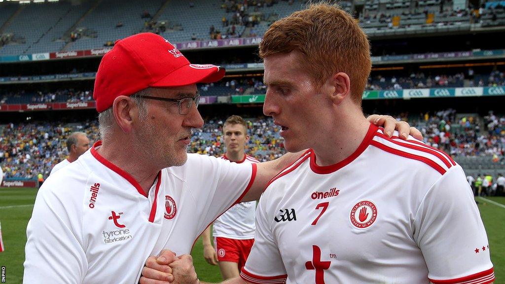 Then Tyrone manager Mickey Harte congratulates nephew Peter Harte after a Red Hands win in 2018